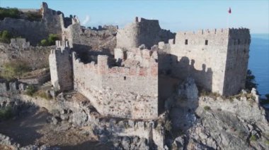 This stock footage shows aerial view of Alanya Castle, Alanya Kalesi in Turkey in 8K
