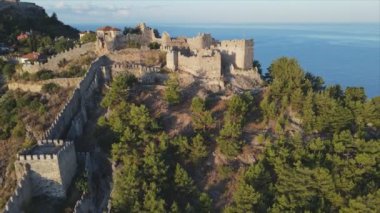 This stock footage shows aerial view of Alanya Castle, Alanya Kalesi in Turkey in 8K