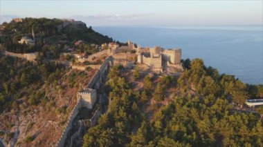 This stock footage shows aerial view of Alanya Castle, Alanya Kalesi in Turkey in 8K