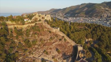 This stock footage shows aerial view of Alanya Castle, Alanya Kalesi in Turkey in 8K