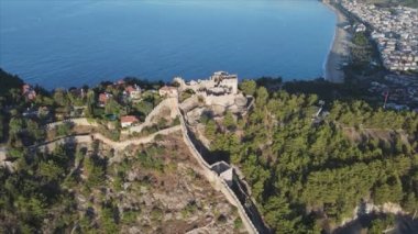 This stock footage shows aerial view of Alanya Castle, Alanya Kalesi in Turkey in 8K