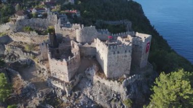 This stock footage shows aerial view of Alanya Castle, Alanya Kalesi in Turkey in 8K