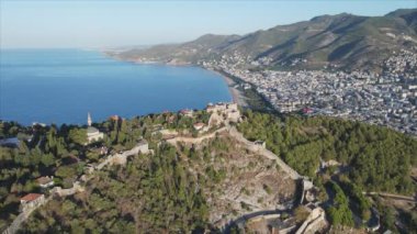 This stock footage shows aerial view of Alanya Castle, Alanya Kalesi in Turkey in 8K