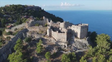 This stock footage shows aerial view of Alanya Castle, Alanya Kalesi in Turkey in 8K