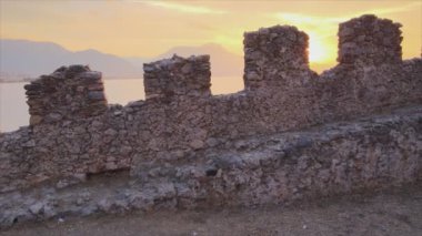 This stock footage shows aerial view of Alanya Castle, Alanya Kalesi in Turkey in 8K