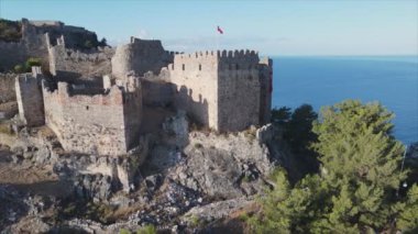 This stock footage shows aerial view of Alanya Castle, Alanya Kalesi in Turkey in 8K