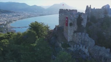 This stock footage shows aerial view of Alanya Castle, Alanya Kalesi in Turkey in 8K