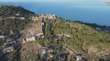 This stock footage shows aerial view of Alanya Castle, Alanya Kalesi in Turkey in 8K