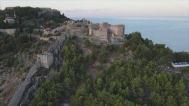 This stock footage shows aerial view of Alanya Castle, Alanya Kalesi in Turkey in 8K