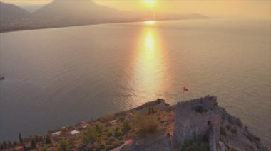 This stock footage shows aerial view of Alanya Castle, Alanya Kalesi in Turkey in 8K