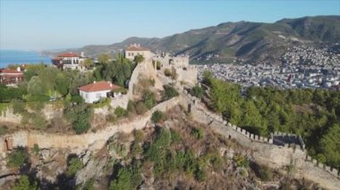 This stock footage shows aerial view of Alanya Castle, Alanya Kalesi in Turkey in 8K