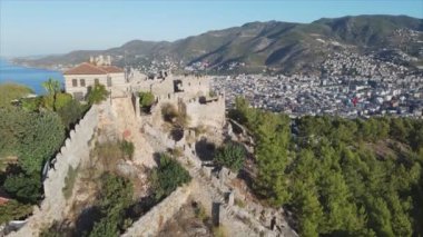 This stock footage shows aerial view of Alanya Castle, Alanya Kalesi in Turkey in 8K