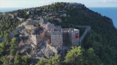This stock footage shows aerial view of Alanya Castle, Alanya Kalesi in Turkey in 8K
