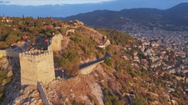 This stock footage shows aerial view of Alanya Castle, Alanya Kalesi in Turkey in 8K