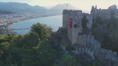 This stock footage shows aerial view of Alanya Castle, Alanya Kalesi in Turkey in 8K