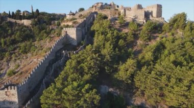 This stock footage shows aerial view of Alanya Castle, Alanya Kalesi in Turkey in 8K