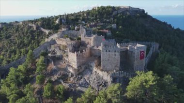 This stock footage shows aerial view of Alanya Castle, Alanya Kalesi in Turkey in 8K