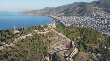 This stock footage shows aerial view of Alanya Castle, Alanya Kalesi in Turkey in 8K