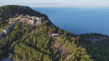This stock footage shows aerial view of Alanya Castle, Alanya Kalesi in Turkey in 8K