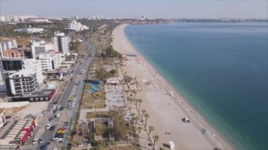 This stock footage shows aerial view of Antalya, Turkey - a resort town on the seashore in 8K resolution