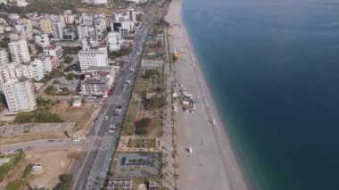 This stock footage shows aerial view of Antalya, Turkey - a resort town on the seashore in 8K resolution