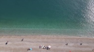 This stock footage shows aerial view of beach at the seaside resort town in Turkey in 8K resolution