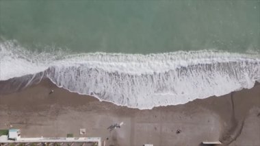 This stock footage shows aerial view of beach at the seaside resort town in Turkey in 8K resolution