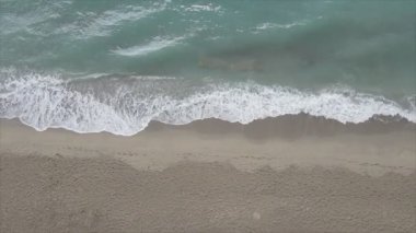 This stock footage shows aerial view of beach at the seaside resort town in Turkey in 8K resolution
