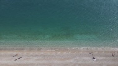 This stock footage shows aerial view of beach at the seaside resort town in Turkey in 8K resolution