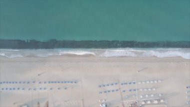 This stock footage shows aerial view of beach at the seaside resort town in Turkey in 8K resolution