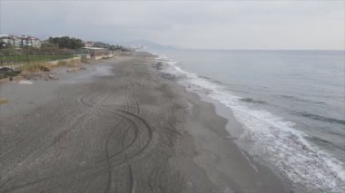 This stock footage shows aerial view of beach at the seaside resort town in Turkey in 8K resolution