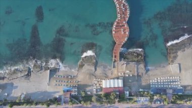 This stock footage shows aerial view of beach at the seaside resort town in Turkey in 8K resolution
