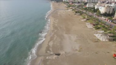 This stock footage shows aerial view of beach at the seaside resort town in Turkey in 8K resolution