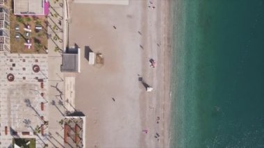 This stock footage shows aerial view of beach at the seaside resort town in Turkey in 8K resolution