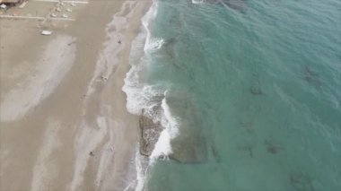 This stock footage shows aerial view of beach at the seaside resort town in Turkey in 8K resolution