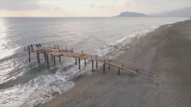 This stock footage shows aerial view of beach at the seaside resort town in Turkey in 8K resolution