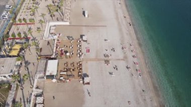 This stock footage shows aerial view of beach at the seaside resort town in Turkey in 8K resolution