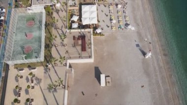 This stock footage shows aerial view of beach at the seaside resort town in Turkey in 8K resolution