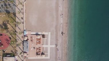 This stock footage shows aerial view of beach at the seaside resort town in Turkey in 8K resolution