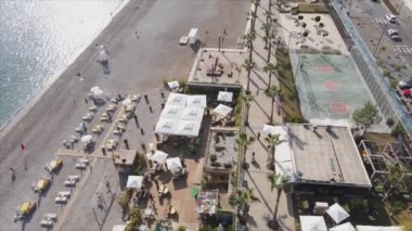 This stock footage shows aerial view of beach at the seaside resort town in Turkey in 8K resolution