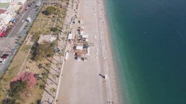 This stock footage shows aerial view of beach at the seaside resort town in Turkey in 8K resolution
