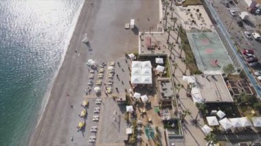 This stock footage shows aerial view of beach at the seaside resort town in Turkey in 8K resolution