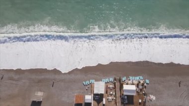 This stock footage shows aerial view of beach at the seaside resort town in Turkey in 8K resolution