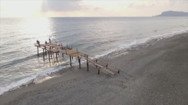 This stock footage shows aerial view of beach at the seaside resort town in Turkey in 8K resolution