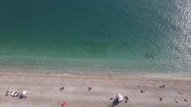 This stock footage shows aerial view of beach at the seaside resort town in Turkey in 8K resolution