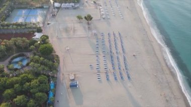 This stock footage shows aerial view of beach at the seaside resort town in Turkey in 8K resolution