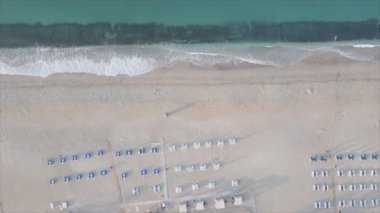 This stock footage shows aerial view of beach at the seaside resort town in Turkey in 8K resolution