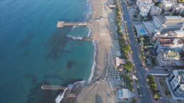 This stock footage shows aerial view of beach at the seaside resort town in Turkey in 8K resolution