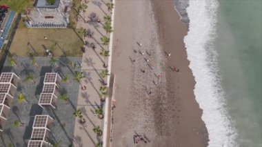 This stock footage shows aerial view of beach at the seaside resort town in Turkey in 8K resolution
