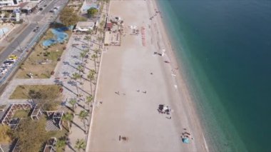 This stock footage shows aerial view of beach at the seaside resort town in Turkey in 8K resolution